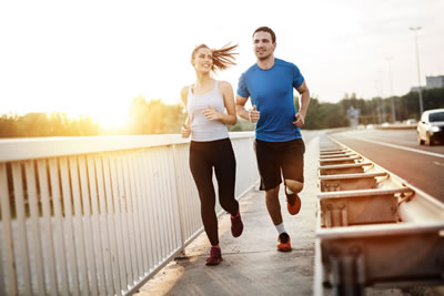 Couple jogging outdoors representing financial fitness